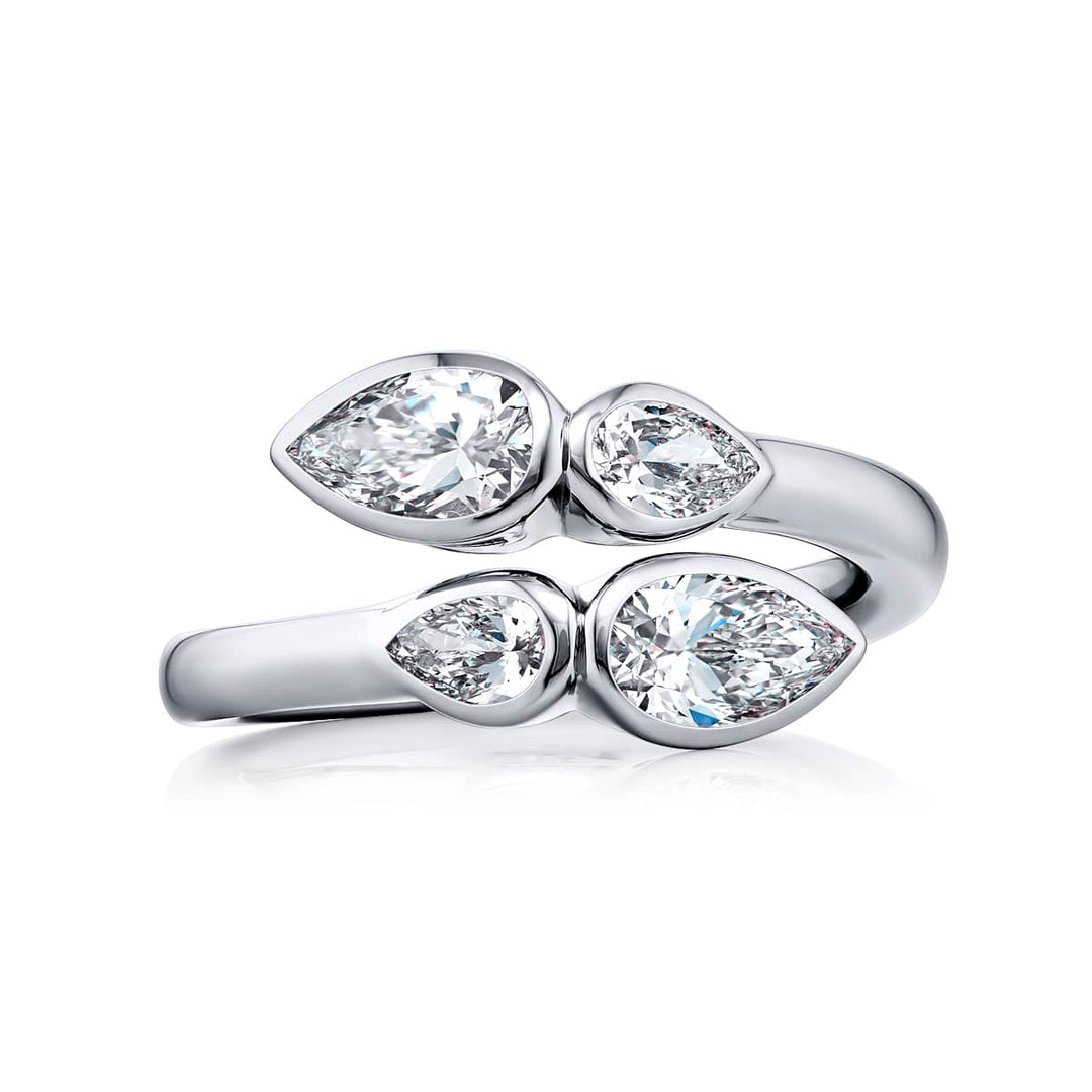 Dazzling Brilliance: Our signature 1.03 ctw. GIA certified Twogether Diamond Ring. These stunning pear-shaped diamonds accompanied by pear-shaped diamonds are handcrafted in pure platinum.