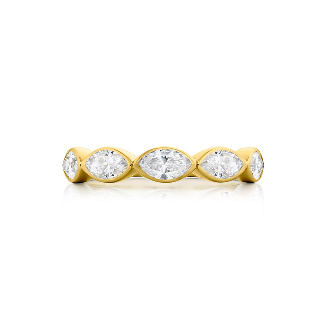 Elegance Elevated: Our stunning 1.26 ctw. East-West Bezel Diamond Band. These five beautiful marquise diamonds are handcrafted in 18K yellow gold.