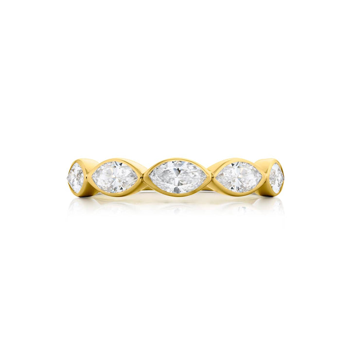Elegance Elevated: Our stunning 1.26 ctw. East-West Bezel Diamond Band. These five beautiful marquise diamonds are handcrafted in 18K yellow gold.