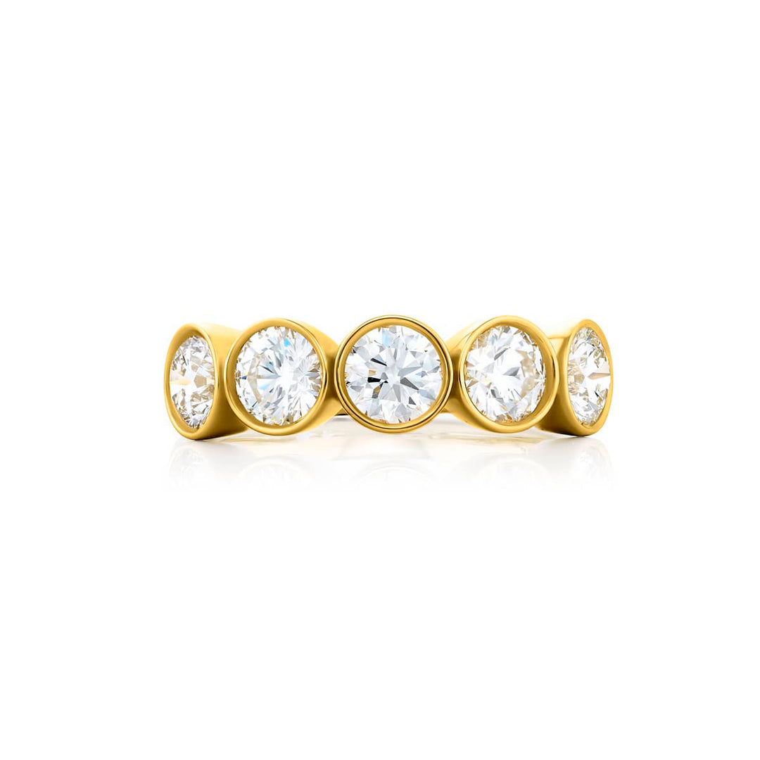 Elegance Elevated: Our signature 2.07 ctw. Bezel Diamond Band. These gorgeous round diamonds are handcrafted in 18KY gold.