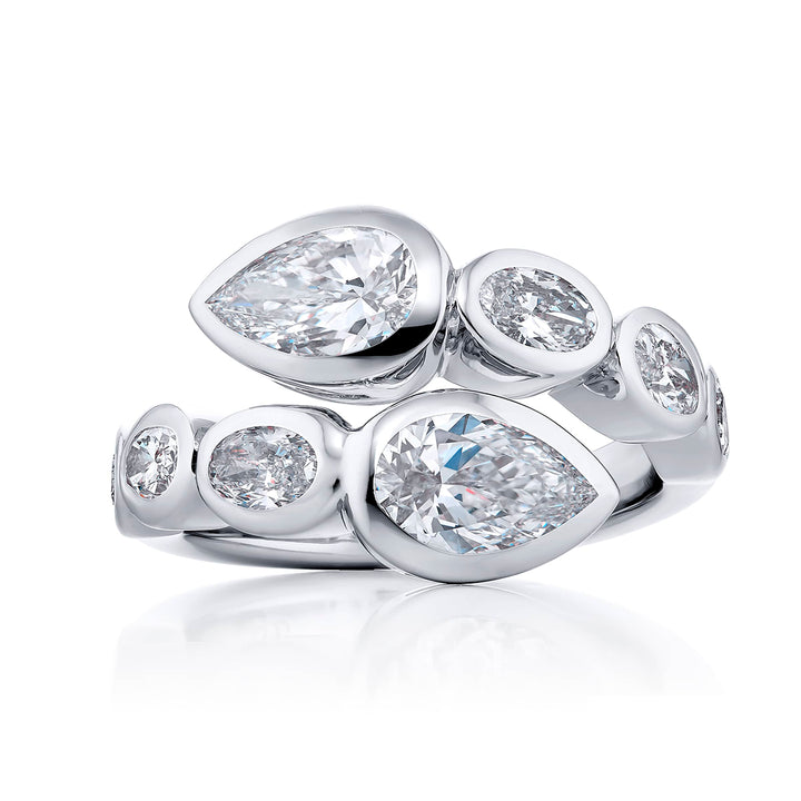 Dazzling Brilliance: Our unique 1.42 ctw. GIA certified Bezel Twogether Diamond Ring. These stunning pear-shaped diamonds accompanied by oval and pear-shaped diamonds are handcrafted in pure platinum.