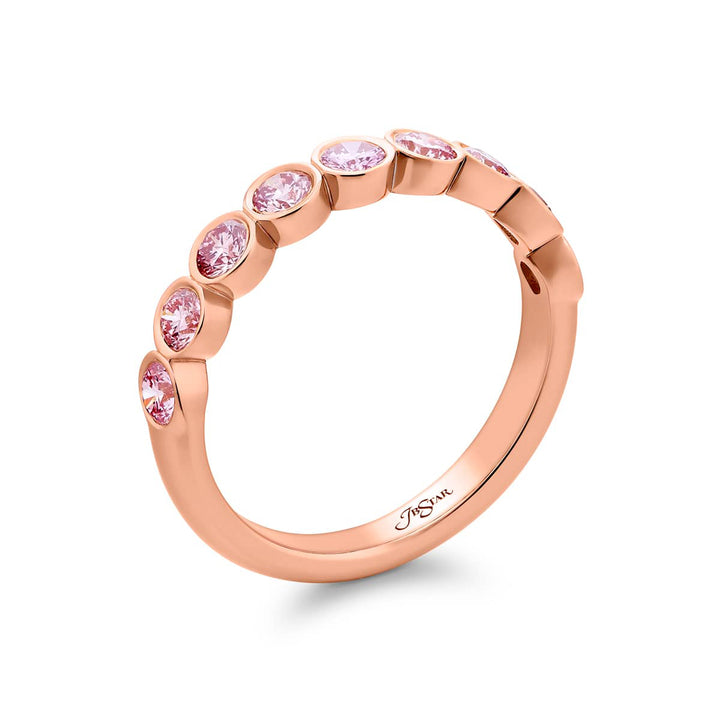 Elegance Elevated: Our stunning 0.95 ctw. East-West Bezel Pink Diamond Band. These nine beautiful round pink diamonds are handcrafted in 18K pink gold.