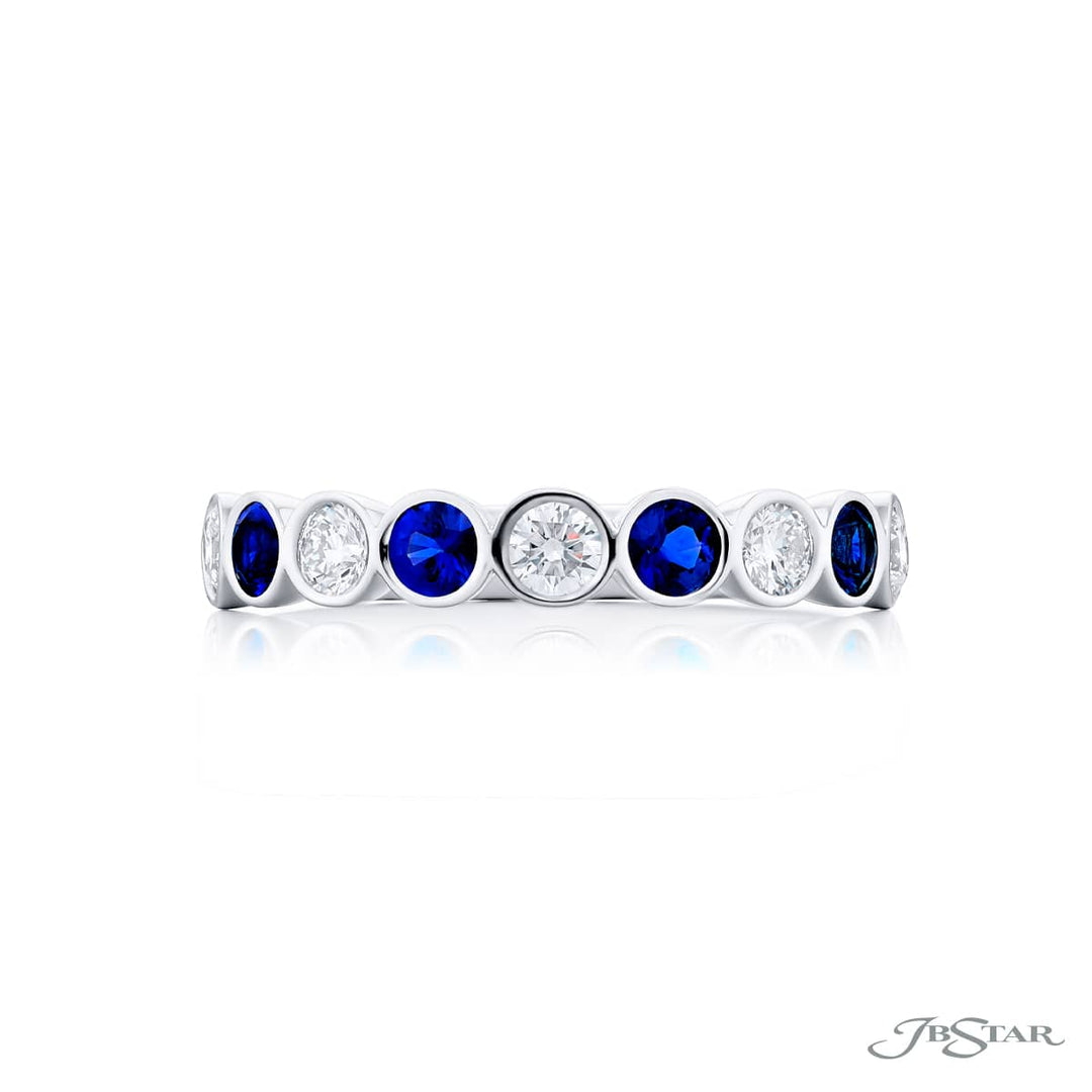 Elegance Elevated: Our stunning East-West Bezel Sapphire and Diamond Band. These beautiful round sapphires blended with round diamonds are handcrafted in pure platinum.