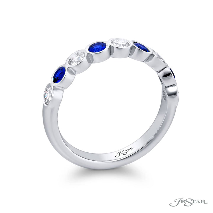 Elegance Elevated: Our stunning East-West Bezel Sapphire and Diamond Band. These beautiful round sapphires blended with round diamonds are handcrafted in pure platinum.