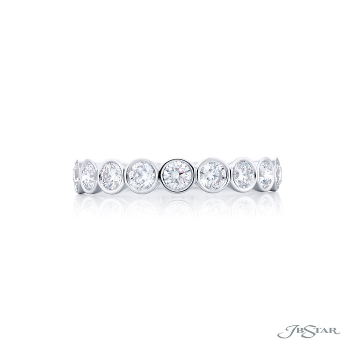 Elegance Elevated: Our stunning Bezel Diamond Band. These nine beautiful round diamonds are handcrafted in pure platinum.