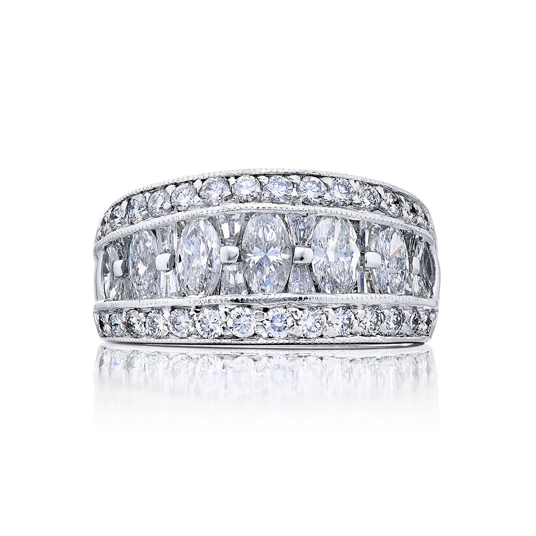 Elegance Elevated: Our beautiful Channel Three-Row Diamond Band. These beautiful marquise diamonds blended with tapered baguettes and pave diamonds are handcrafted in pure platinum.