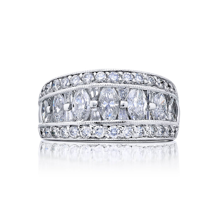 Elegance Elevated: Our beautiful Channel Three-Row Diamond Band. These beautiful marquise diamonds blended with tapered baguettes and pave diamonds are handcrafted in pure platinum.