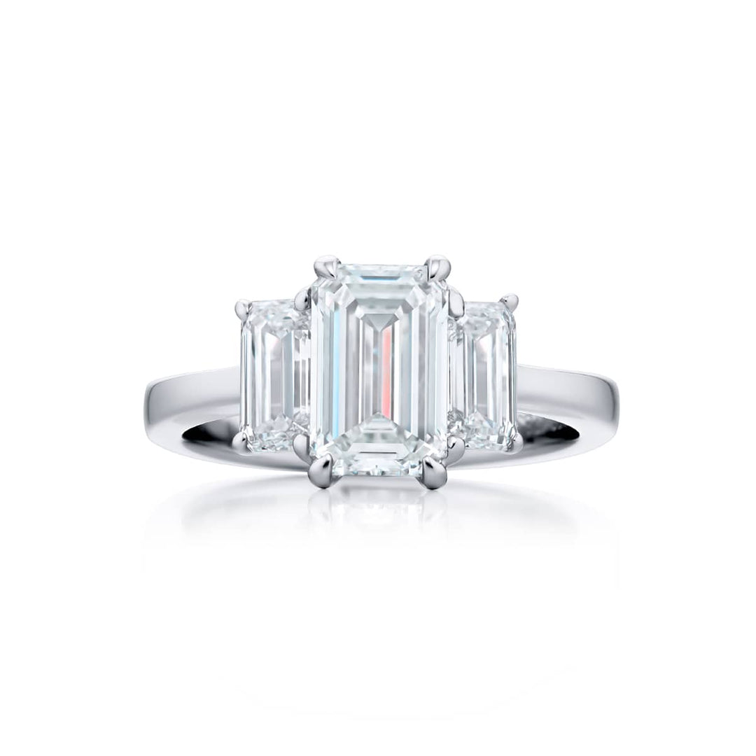 Dazzling Brilliance: Our timeless 1.51 ct. GIA certified Diamond Ring. This gorgeous emerald-cut diamond flanked by matching emerald-cut diamonds is handcrafted in pure platinum.