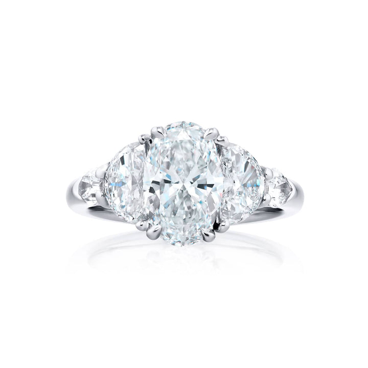 Dazzling Brilliance: Our timeless 2.01 ct. GIA certified Diamond Ring. This gorgeous oval diamond flanked by half-moon and shield diamonds is handcrafted in pure platinum.