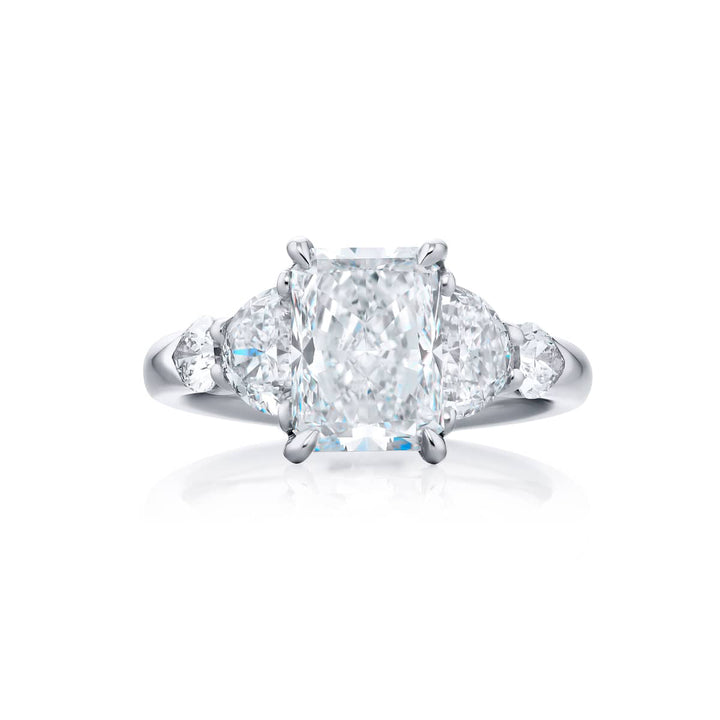 Dazzling Brilliance: Our timeless 2.50 ct. GIA certified Diamond Ring. This gorgeous radiant-cut diamond flanked by shield and half-moon diamonds is handcrafted in pure platinum.