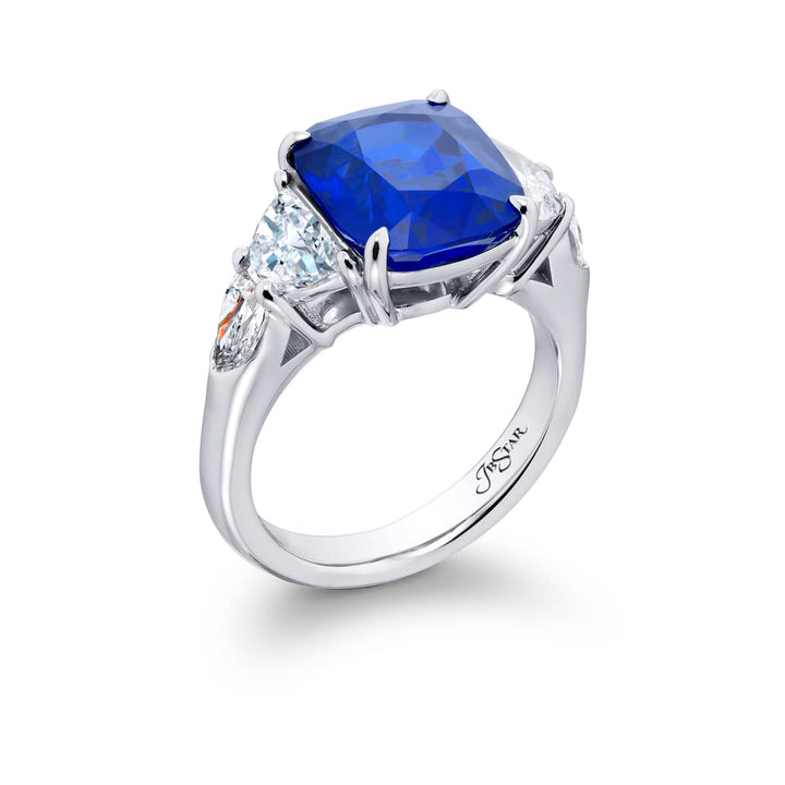 Breathtaking Radiance: Our stunning 7.04 ct. certified Sri Lankan Sapphire Ring. This beautiful cushion-cut sapphire crowned in dazzling shield and half-moon diamonds is handcrafted in pure platinum.