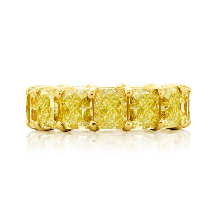 Alluring Eternity: Our magnificent 14.37 ctw. GIA certified Fancy Yellow Diamond Eternity Band. These fourteen dazzling radiant-cut fancy yellow diamonds are handcrafted in 18KY gold.