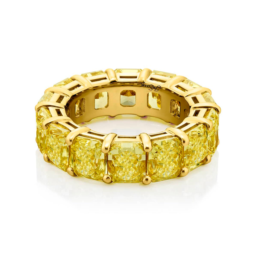 Alluring Eternity: Our magnificent 14.37 ctw. GIA certified Fancy Yellow Diamond Eternity Band. These fourteen dazzling radiant-cut fancy yellow diamonds are handcrafted in 18KY gold.