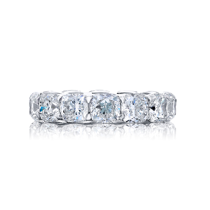Alluring Eternity: Our beautiful single-row Diamond Eternity Band. This fourteen cushion-cut diamond ring is handcrafted in pure platinum.