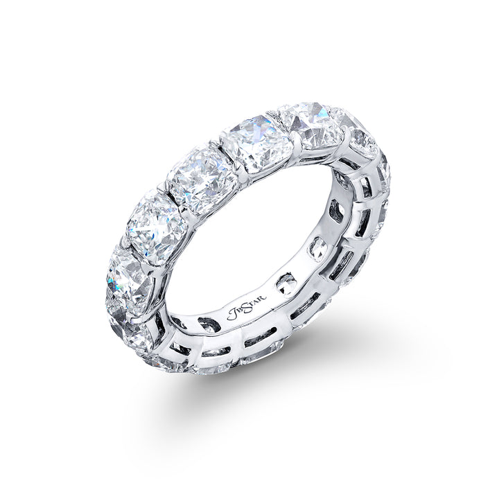 Alluring Eternity: Our beautiful single-row Diamond Eternity Band. This fourteen cushion-cut diamond ring is handcrafted in pure platinum.