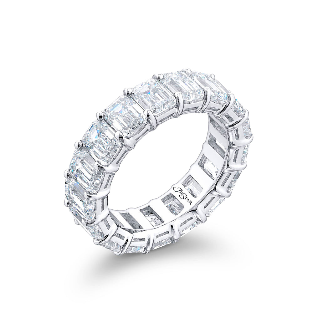 Alluring Eternity: Our beautiful single-row Diamond Eternity Band. This seventeen emerald-cut diamond ring is handcrafted in pure platinum.