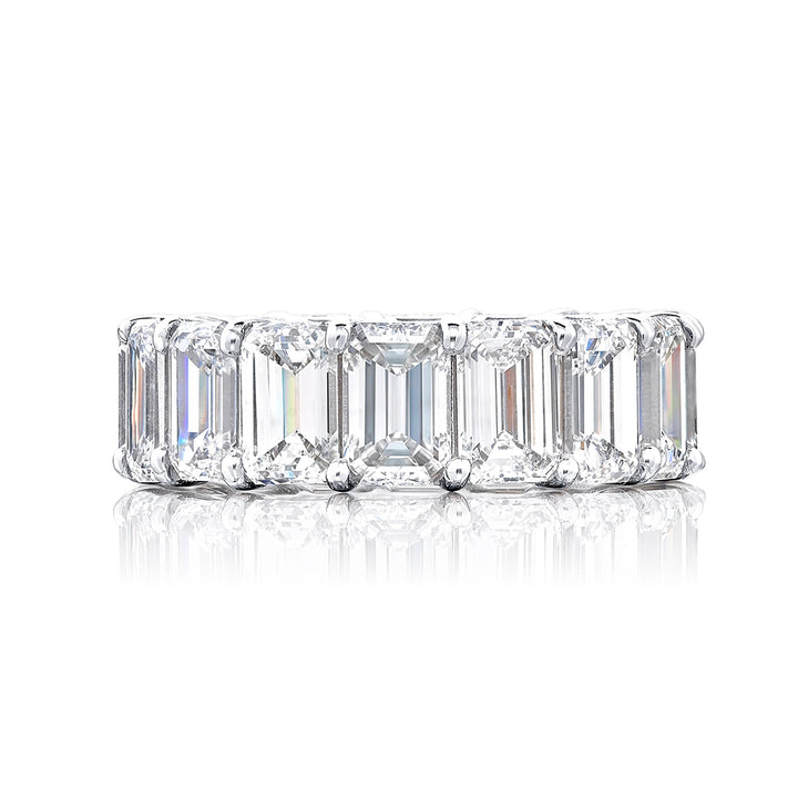 Alluring Eternity: Our beautiful single row certified diamond eternity band. These 16 perfectly matched emerald-cut diamonds are set in a shared prong and are meticulously handcrafted in pure platinum.