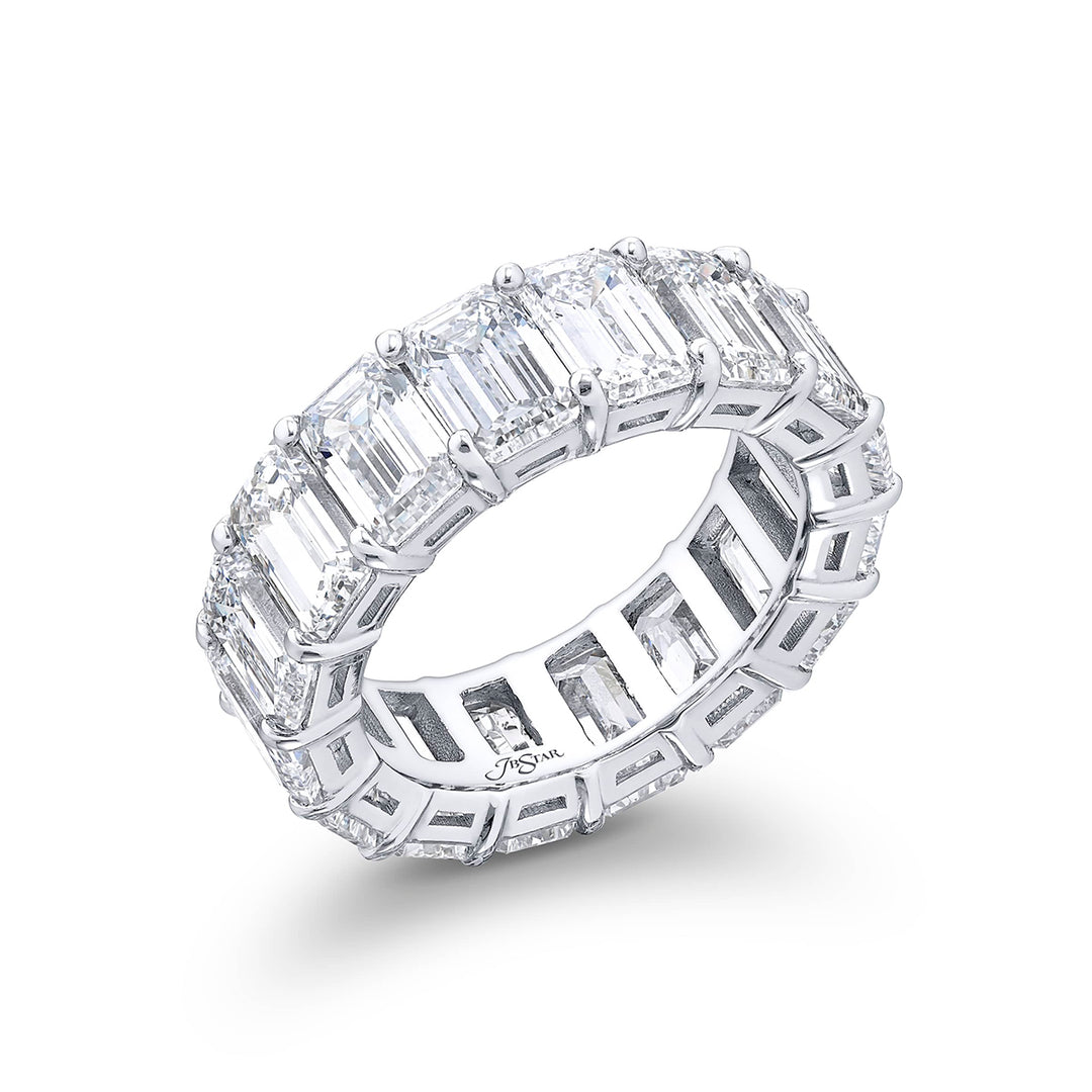Alluring Eternity: Our beautiful single row certified diamond eternity band. These 16 perfectly matched emerald-cut diamonds are set in a shared prong and are meticulously handcrafted in pure platinum.