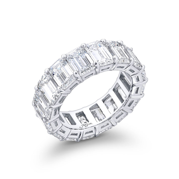 Alluring Eternity: Our beautiful single row certified diamond eternity band. These 16 perfectly matched emerald-cut diamonds are set in a shared prong and are meticulously handcrafted in pure platinum.
