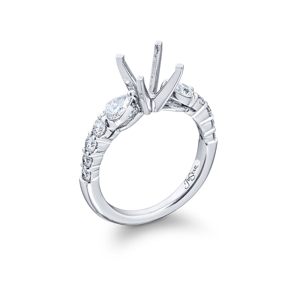 Dazzling Brilliance: Our timeless Diamond Semi-mount. These two pear-shaped diamonds accompanied by eight beautiful round diamonds are handcrafted in pure platinum.