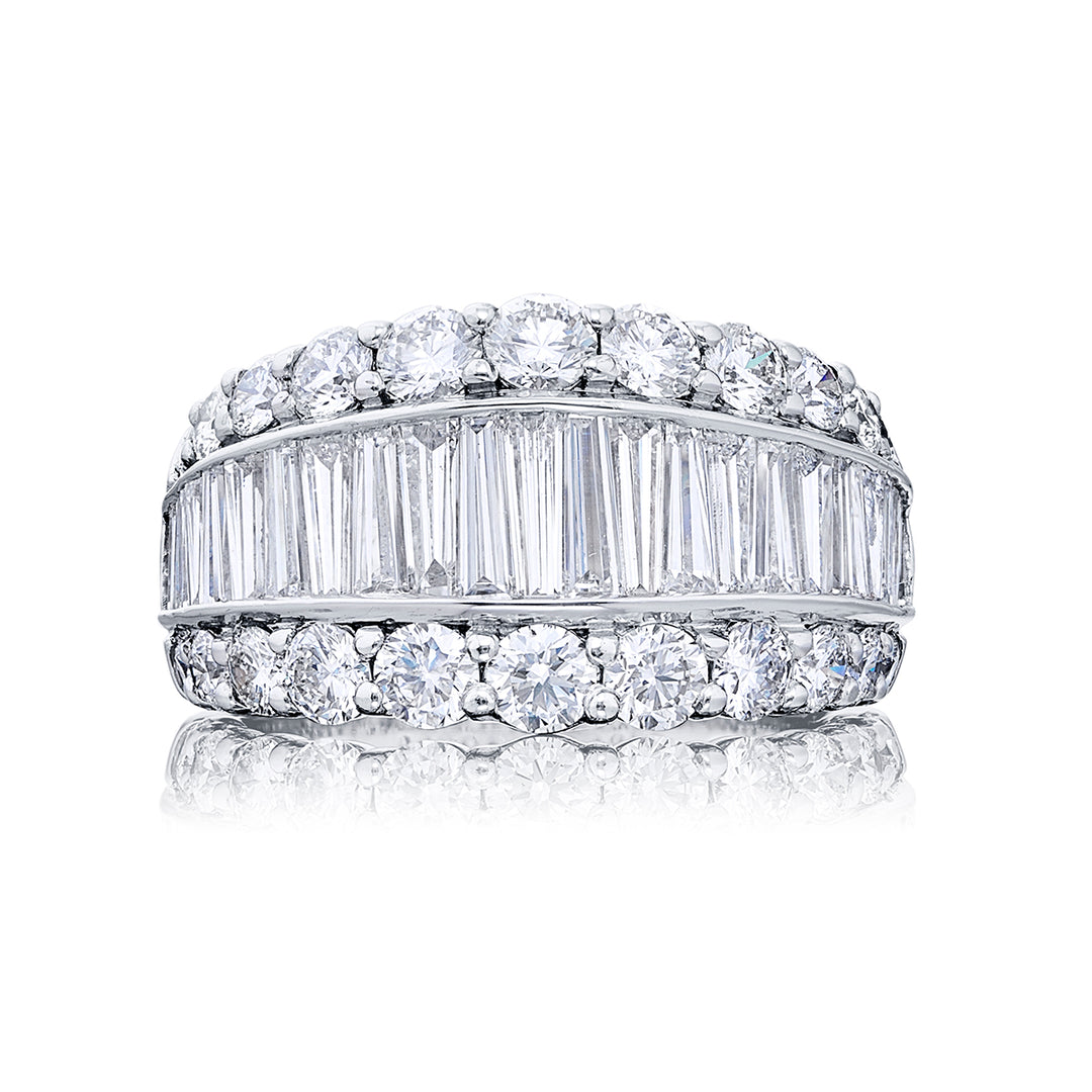 Elegance Elevated: Our classic Channel Diamond Band. These twenty-three beautiful straight baguette diamonds embraced by round diamonds are handcrafted in pure platinum.