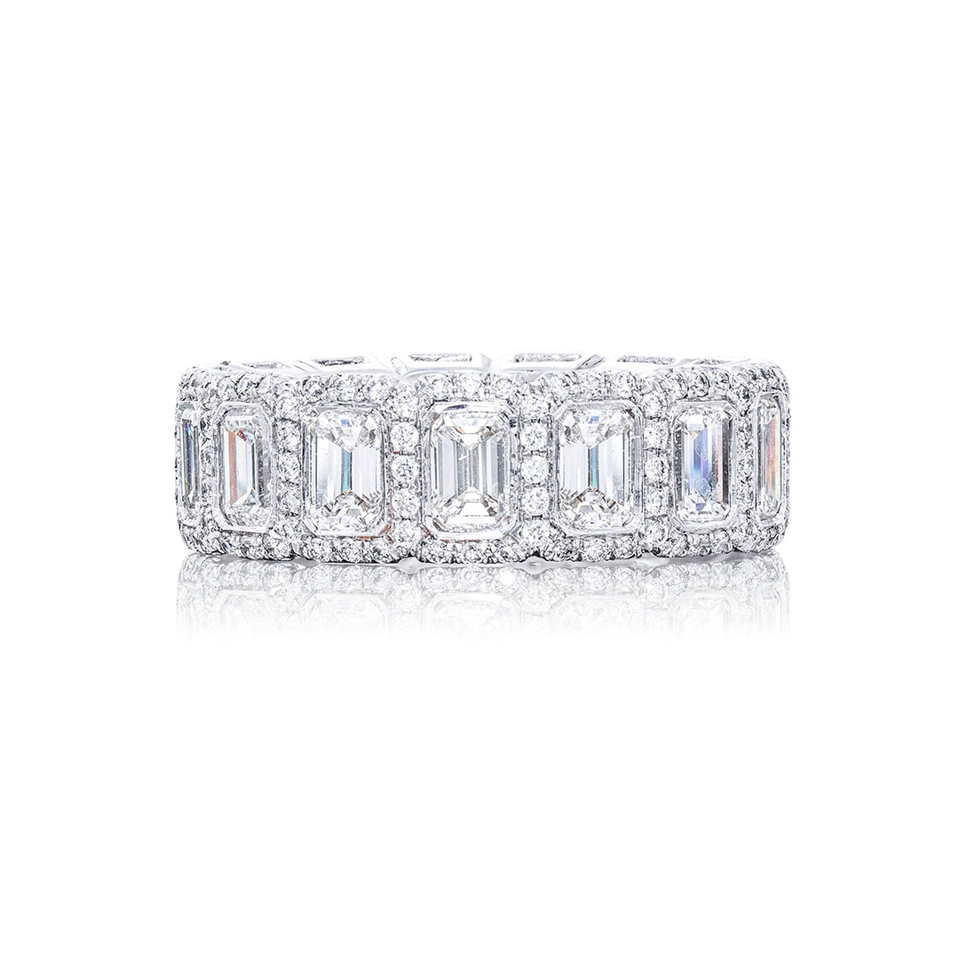 An exquisite diamond eternity band adorned with 14 emerald-cut diamonds securely bezel-set within a round pave design. This gorgeous piece is meticulously handcrafted from pure platinum showcasing exceptional craftsmanship and timeless elegance