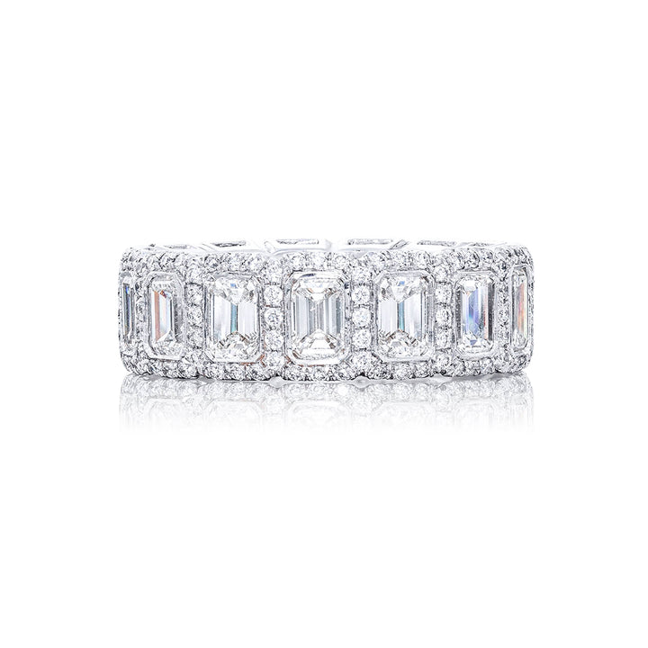 An exquisite diamond eternity band adorned with 14 emerald-cut diamonds securely bezel-set within a round pave design. This gorgeous piece is meticulously handcrafted from pure platinum showcasing exceptional craftsmanship and timeless elegance