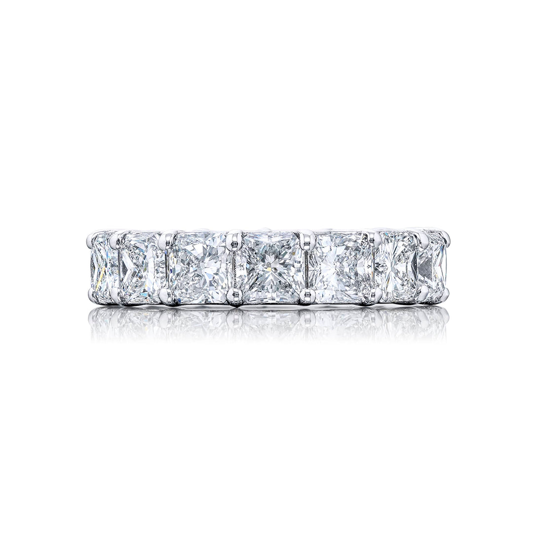An exquisite eternity band meticulously handcrafted in pure platinum showcasing 15 impeccably matched radiant-cut diamonds set within a shared prong arrangement radiating timeless beauty.