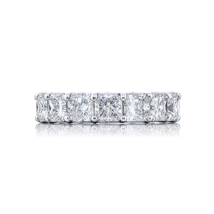 An exquisite eternity band meticulously handcrafted in pure platinum showcasing 15 impeccably matched radiant-cut diamonds set within a shared prong arrangement radiating timeless beauty.