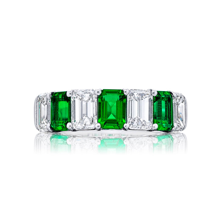 Gorgeous emerald and diamond wedding band featuring 4 perfectly matched emerald-cut diamonds and 3 emerald-cut emeralds in a shared prong setting. Handcrafted in pure platinum.