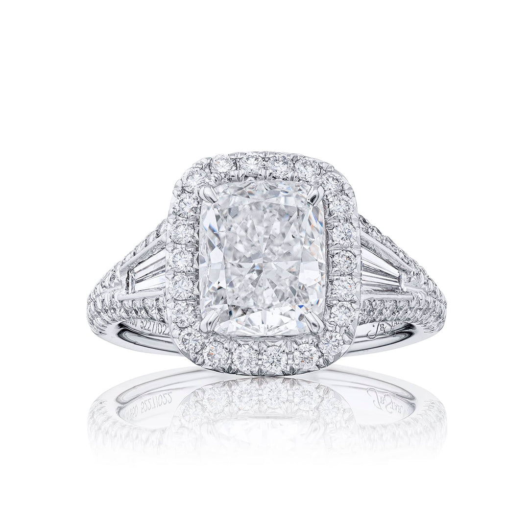 Dazzling diamond engagement ring featuring a 2.55 ct. cushion-cut diamond center embraced by tapered baguette in a micro pave setting. Handcrafted in pure platinum.