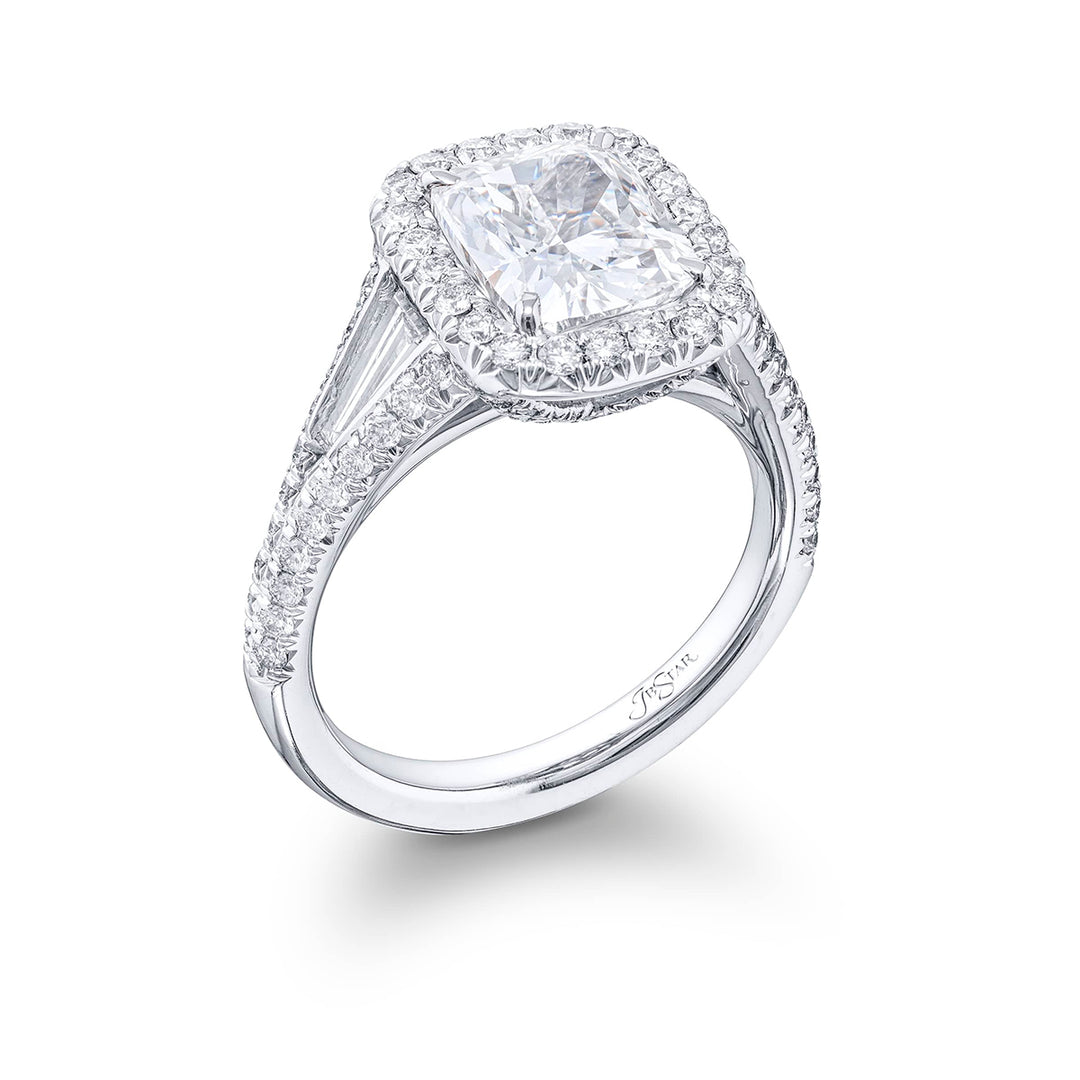 Dazzling diamond engagement ring featuring a 2.55 ct. cushion-cut diamond center embraced by tapered baguette in a micro pave setting. Handcrafted in pure platinum.