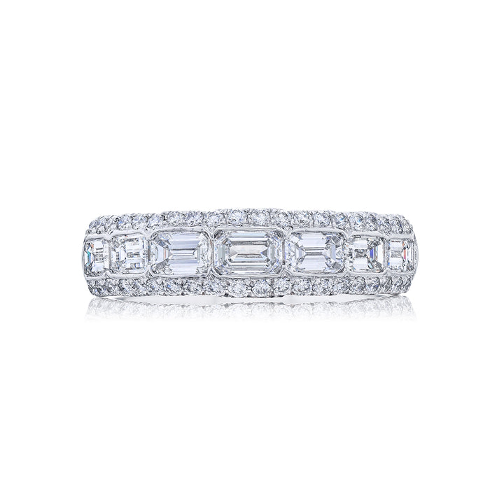 Elegance Elevated: Our signature East-West Channel Diamond Band. These gorgeous seven emerald-cut diamonds embraced by micro pave diamonds are handcrafted in pure platinum.