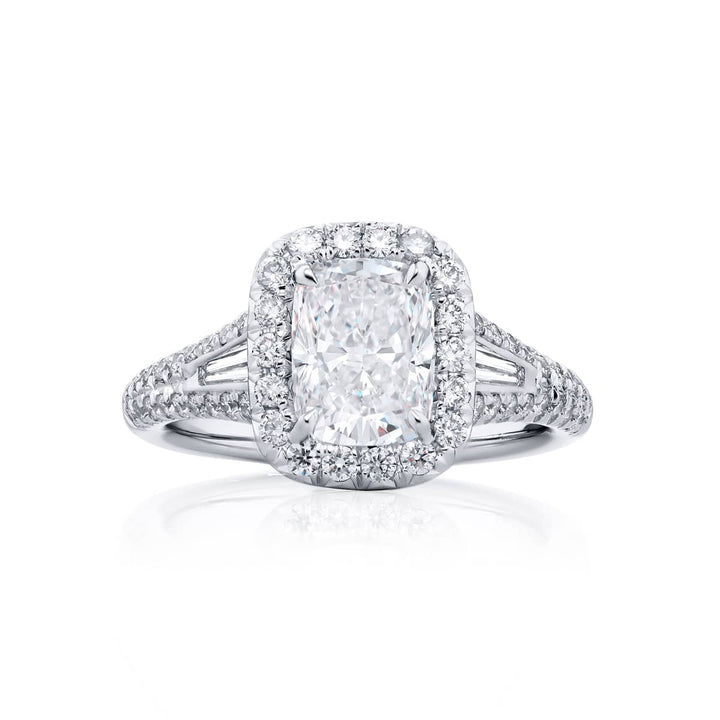 Dazzling Brilliance: Our timeless 1.50 ct. GIA certified Diamond Ring. This beautiful cushion-cut diamond cradled in tapered baguette and micro pave diamonds is handcrafted in pure platinum.