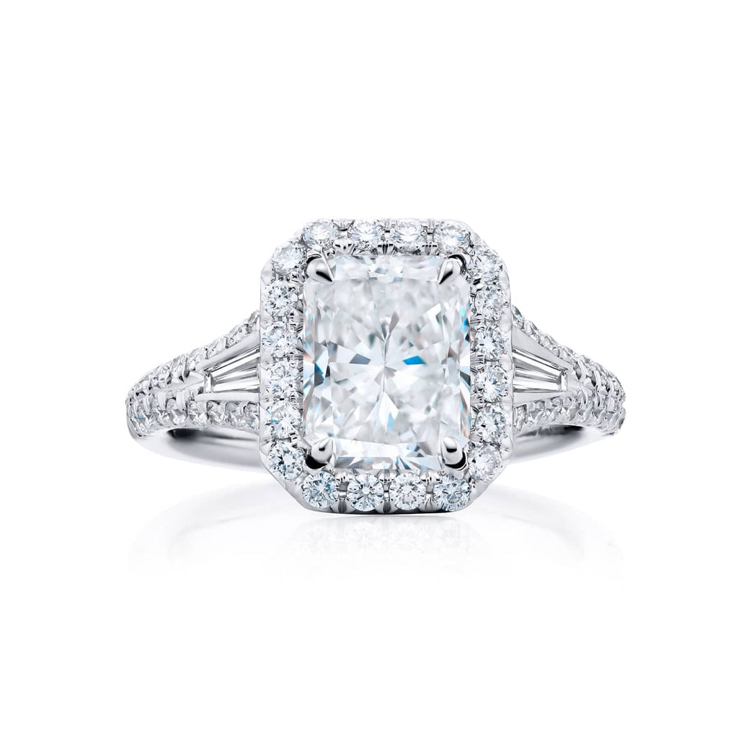 Dazzling Brilliance: Our timeless 1.70 ct. GIA certified Diamond Ring. This beautiful radiant-cut diamond accompanied by tapered baguette and micro pave diamonds is handcrafted in pure platinum.