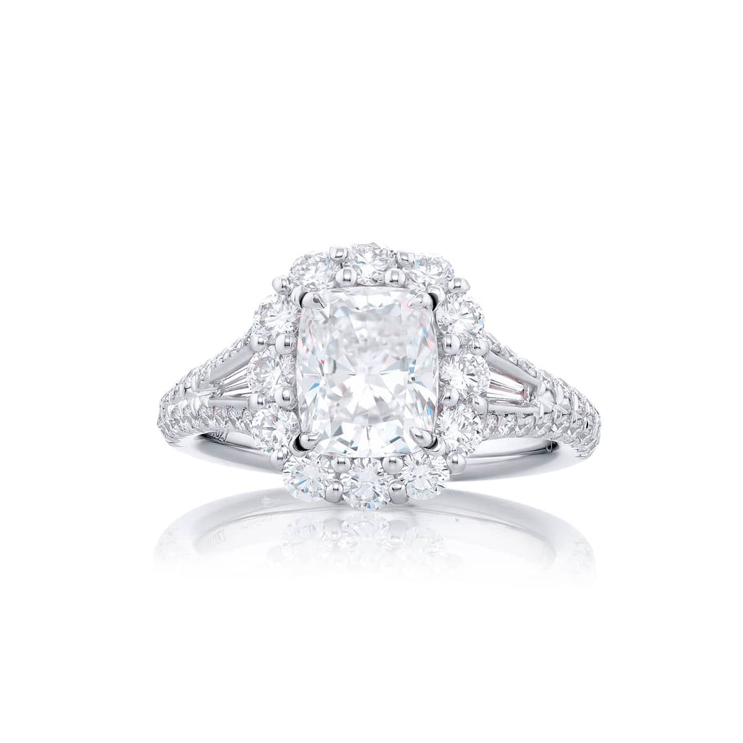 Dazzling Brilliance: Our stunning 1.51 ct. GIA certified Diamond Ring. This beautiful cushion-cut diamond cradled in tapered baguette and round diamonds is handcrafted in pure platinum.