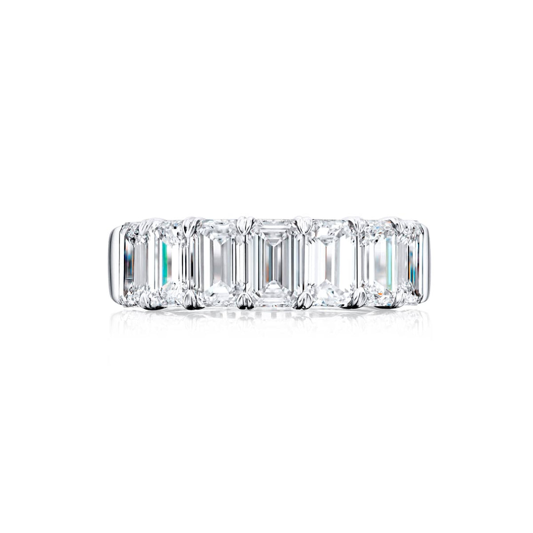 Elegance Elevated: Our stunning 3.73 ctw. GIA certified Diamond Band. These seven beautiful emerald-cut diamonds are handcrafted in pure platinum.