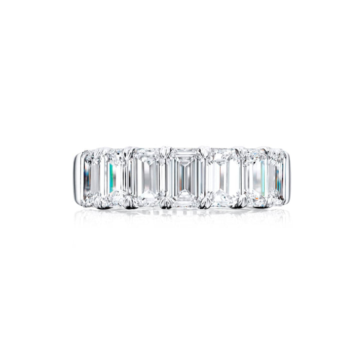 Elegance Elevated: Our stunning 3.73 ctw. GIA certified Diamond Band. These seven beautiful emerald-cut diamonds are handcrafted in pure platinum.