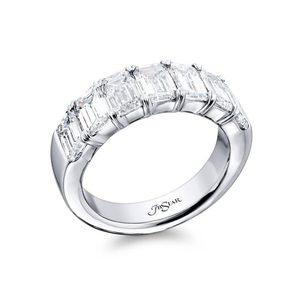 Elegance Elevated: Our stunning 3.73 ctw. GIA certified Diamond Band. These seven beautiful emerald-cut diamonds are handcrafted in pure platinum.