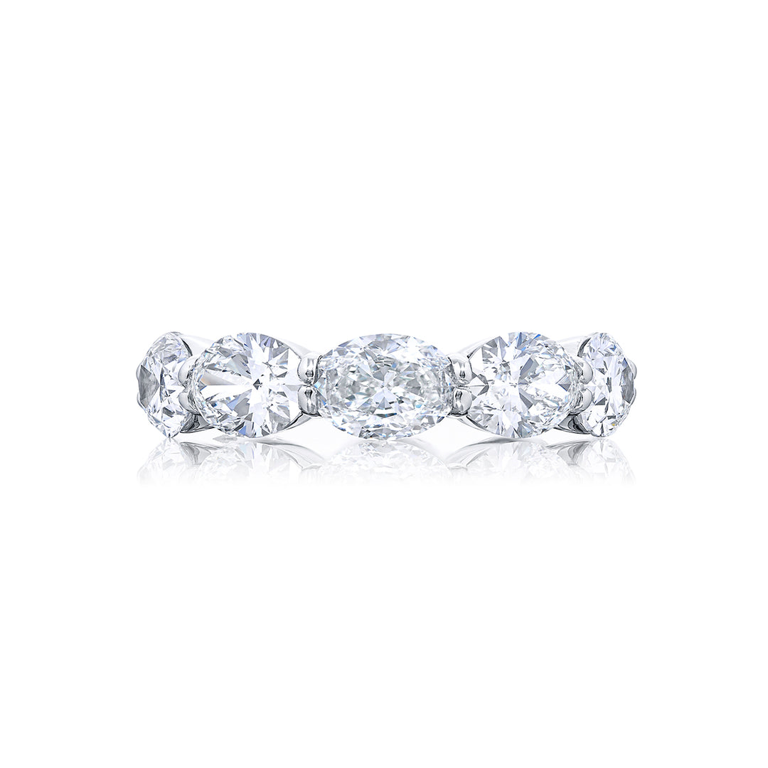 Exquisite in its beauty this diamond eternity band showcases 10 GIA-certified oval diamonds flawlessly set in an east-west orientation with shared prongs. Handcrafted from pure platinum it radiates timeless elegance and allure