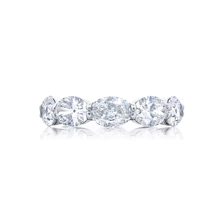 Exquisite in its beauty this diamond eternity band showcases 10 GIA-certified oval diamonds flawlessly set in an east-west orientation with shared prongs. Handcrafted from pure platinum it radiates timeless elegance and allure