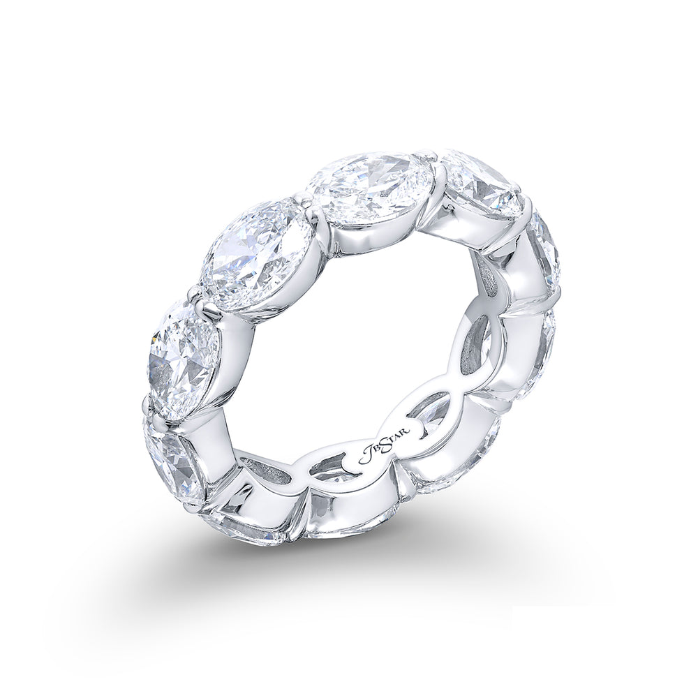 Exquisite in its beauty this diamond eternity band showcases 10 GIA-certified oval diamonds flawlessly set in an east-west orientation with shared prongs. Handcrafted from pure platinum it radiates timeless elegance and allure