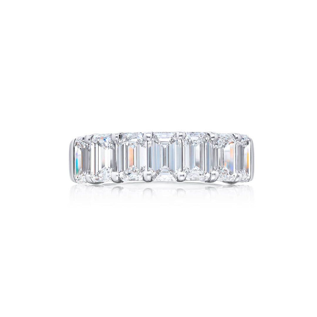 Elegance Elevated: Our stunning single row 3.61 ctw. GIA certified Diamond Band. These seven beautiful emerald-cut diamonds are handcrafted in pure platinum.