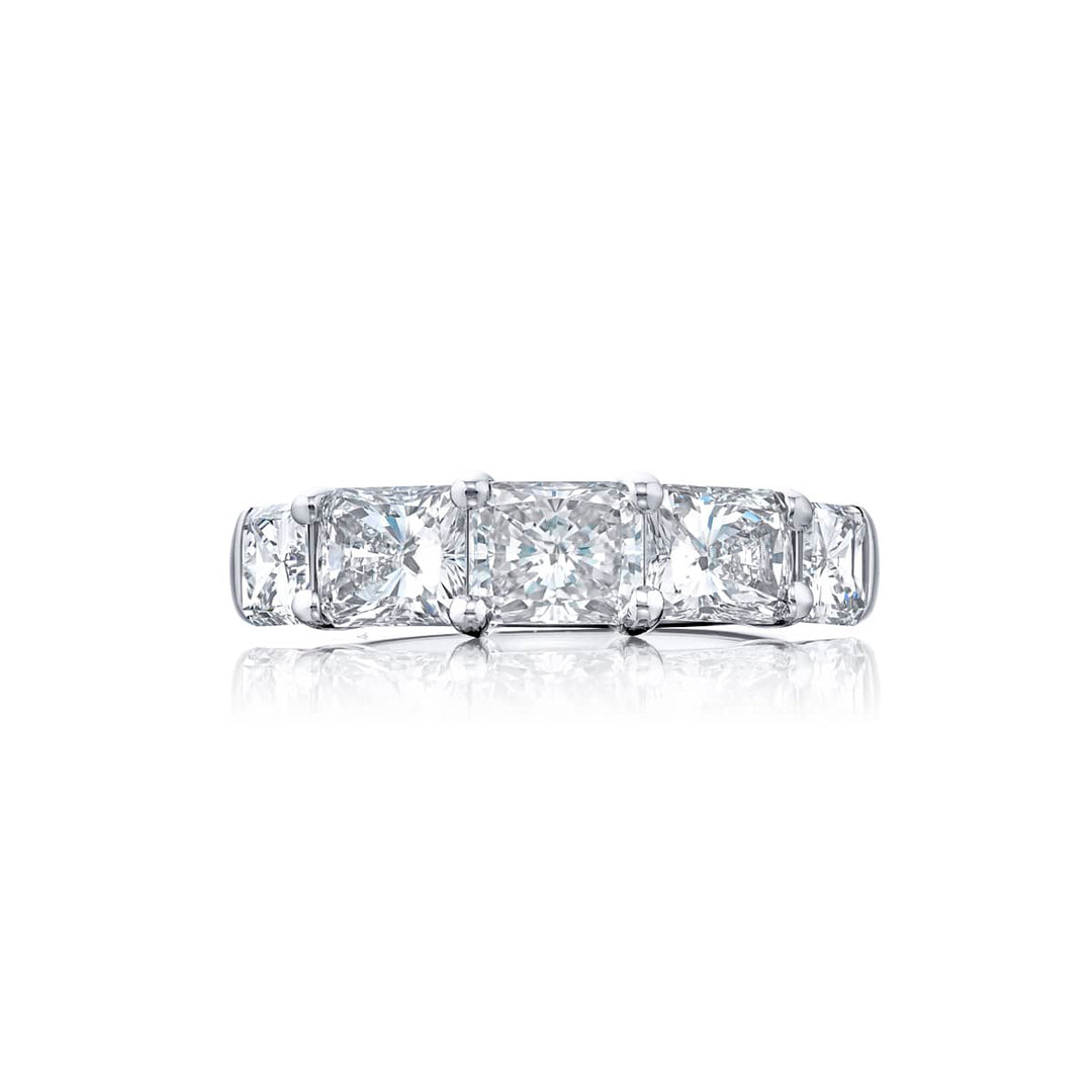 Elegance Elevated: Our classic East-West Diamond Band. These stunning five radiant-cut diamonds are handcrafted in pure platinum.