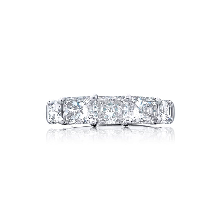 Elegance Elevated: Our classic East-West Diamond Band. These stunning five radiant-cut diamonds are handcrafted in pure platinum.