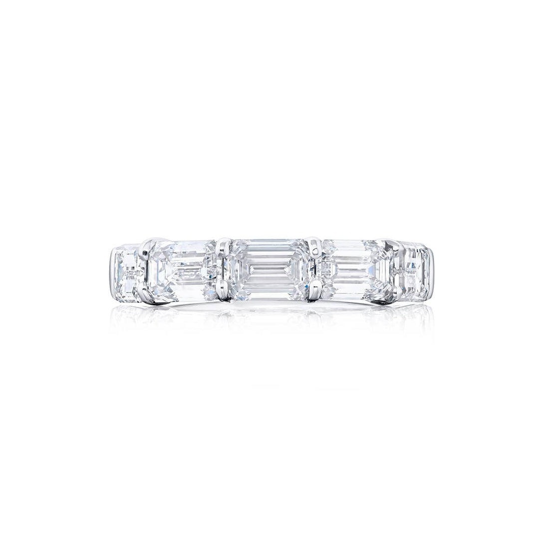 Elegance Elevated: Our stunning 3.60 ctw. East-West GIA certified Diamond Band. These five beautiful emerald-cut diamonds are handcrafted in pure platinum.