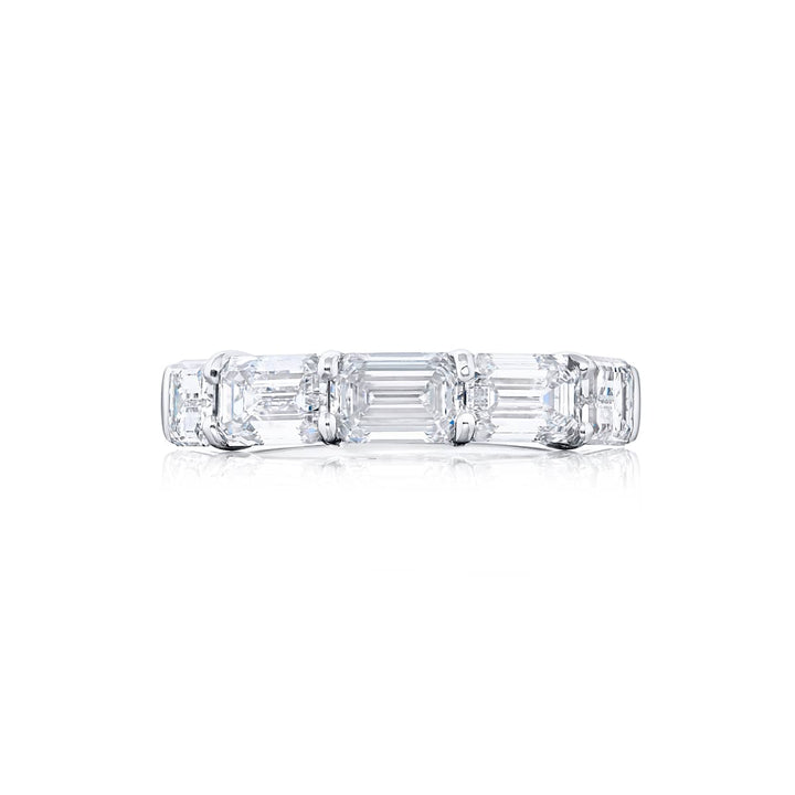 Elegance Elevated: Our stunning 3.60 ctw. East-West GIA certified Diamond Band. These five beautiful emerald-cut diamonds are handcrafted in pure platinum.