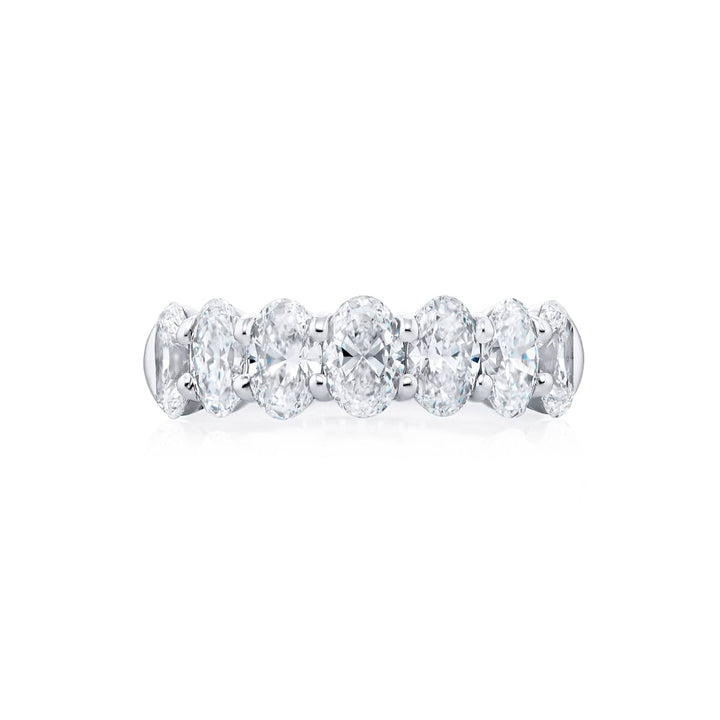 Elegance Elevated: Our signature 2.92 ctw. GIA certified Diamond Band. These seven gorgeous oval diamonds are handcrafted in pure platinum.