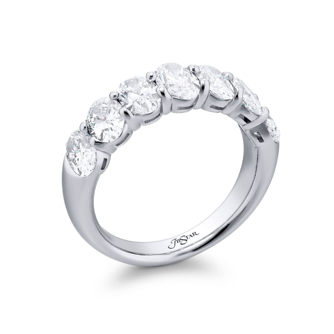 Elegance Elevated: Our signature 2.92 ctw. GIA certified Diamond Band. These seven gorgeous oval diamonds are handcrafted in pure platinum.