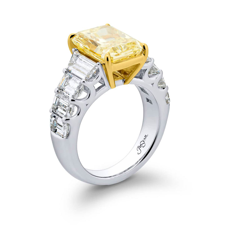 Dazzling Brilliance: Our magnificent 5.14 ct. GIA certified Fancy Yellow Diamond Ring. This beautiful radiant-cut fancy yellow diamond flanked by emerald-cut and tapered baguette diamonds is handcrafted in pure platinum and 18KY gold.